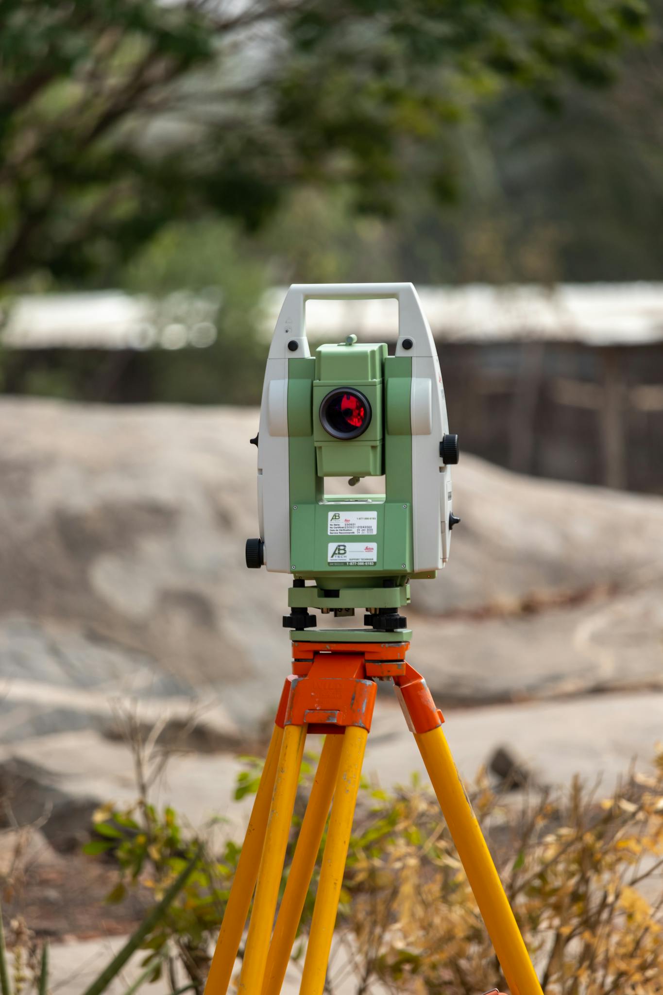 A surveying theodolite set on a tripod outdoors in Dassa, Benin, ideal for civil engineering projects.